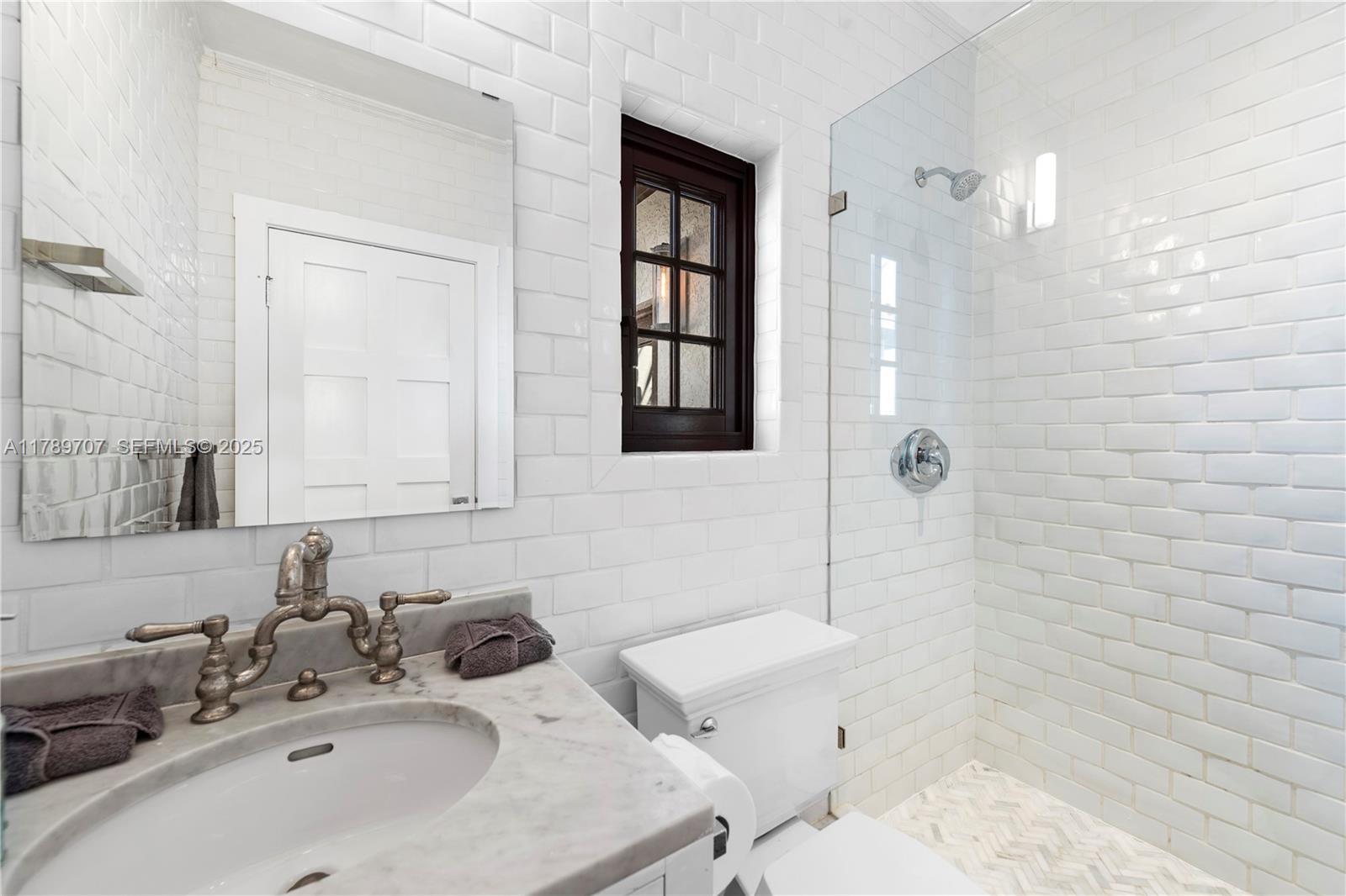 1201 Northeast 83rd Street Miami, FL 33138 - Photo 47 of 67 a bathroom with a sink a toilet and shower