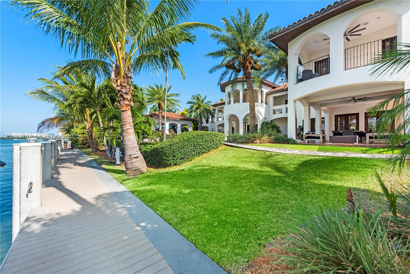 1201 Northeast 83rd Street Miami, FL 33138 - Photo 67 of 67 a view of a swimming pool with a garden and palm trees