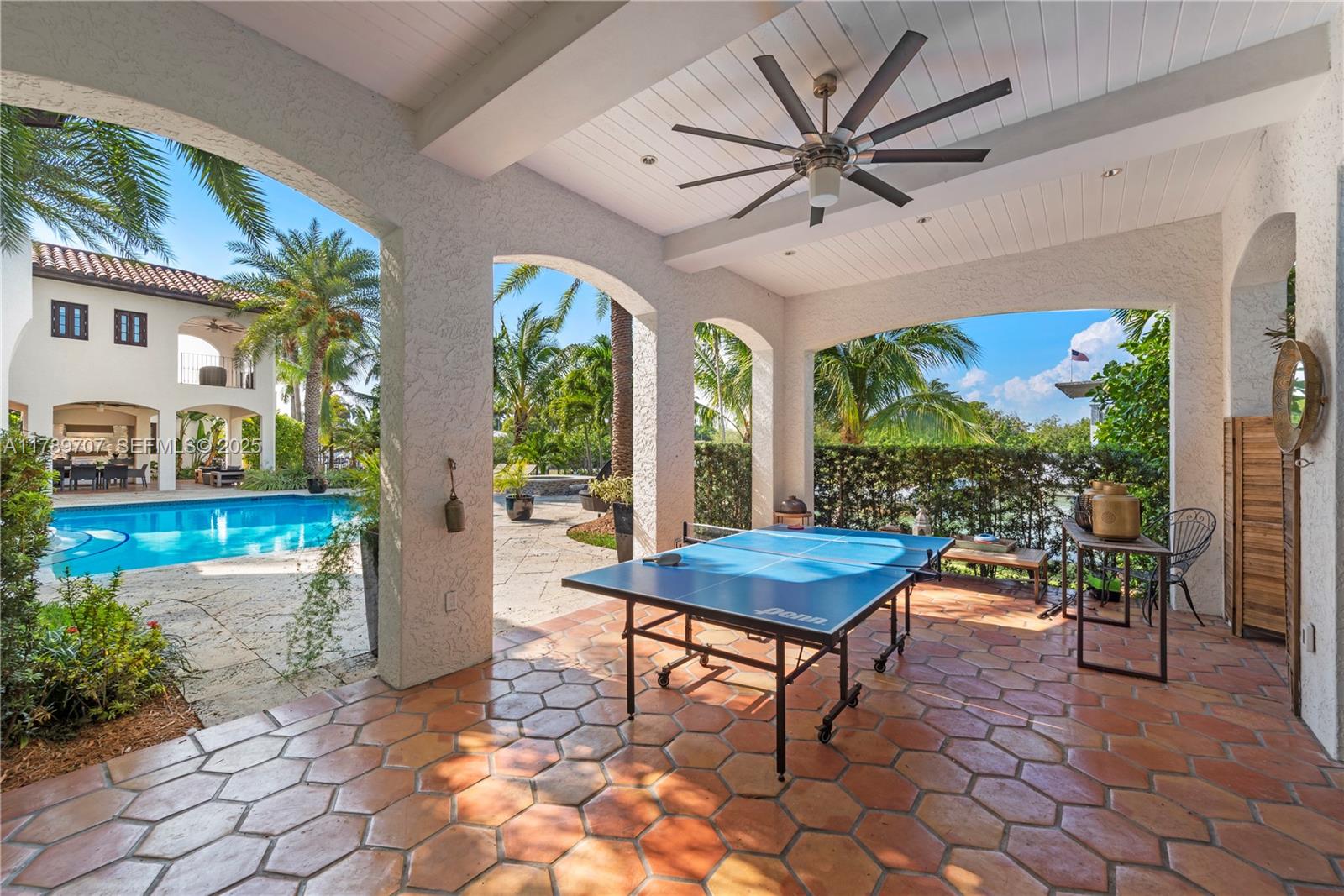 1201 Northeast 83rd Street Miami, FL 33138 - Photo 8 of 67 a living room with patio furniture and a large window