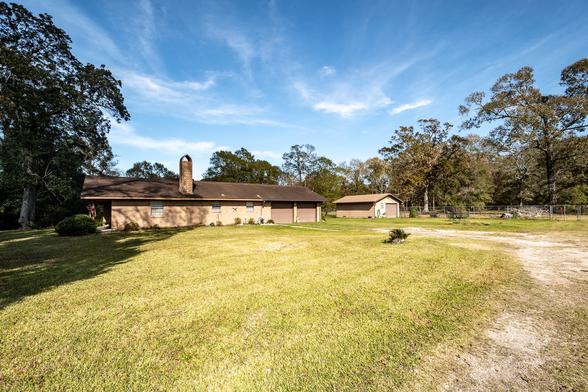 10488 Fostoria Road Cleveland, TX 77328 - Photo 2 of 16 a view of a swimming pool with an outdoor space and seating area