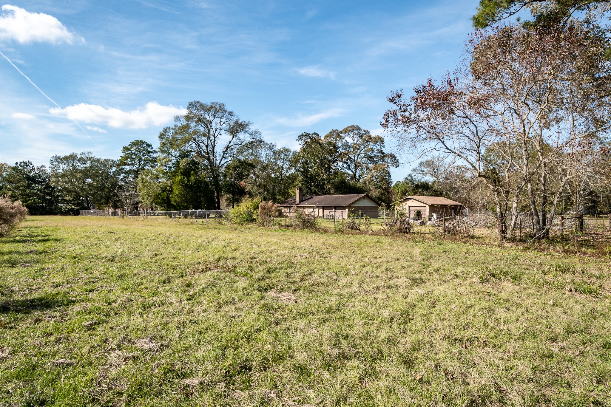 10488 Fostoria Road Cleveland, TX 77328 - Photo 7 of 16 a view of a lake with houses