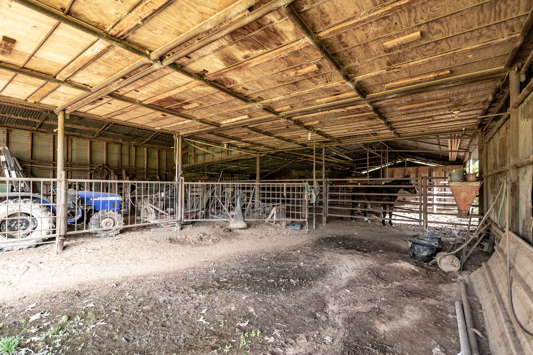 10488 Fostoria Road Cleveland, TX 77328 - Photo 8 of 16 a view of garage with wooden ceiling