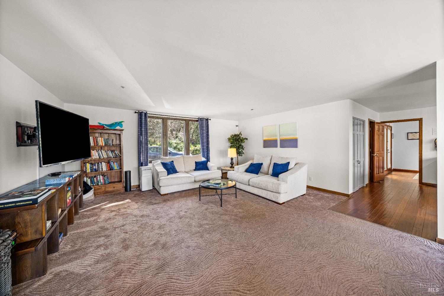 8 Circle Road San Rafael, CA 94903 - Photo 19 of 45 a living room with furniture and a flat screen tv