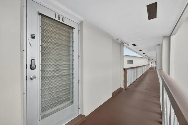 a view of a hallway with the stairs