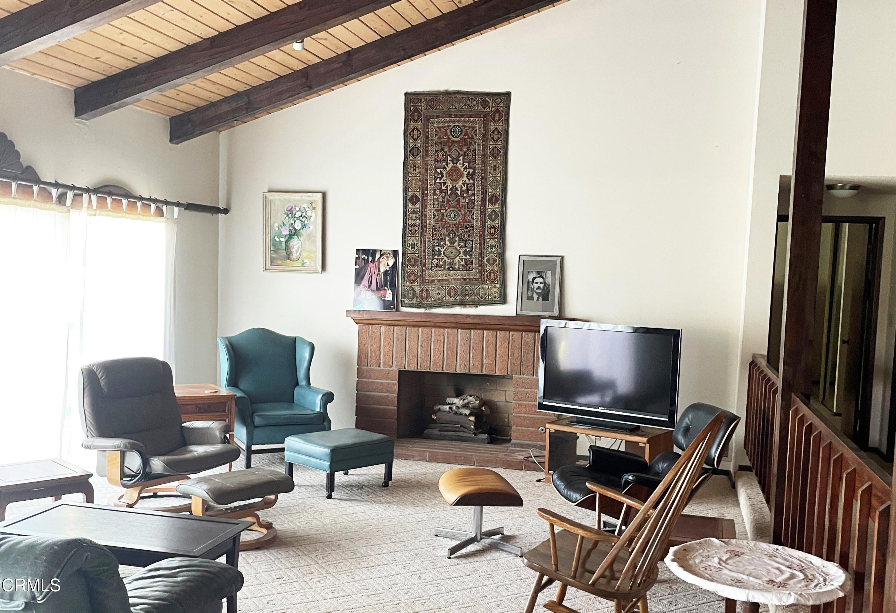 75 Marine View Drive Camarillo, CA 93010 - Photo 7 of 18 a living room with furniture a flat screen tv and a fireplace