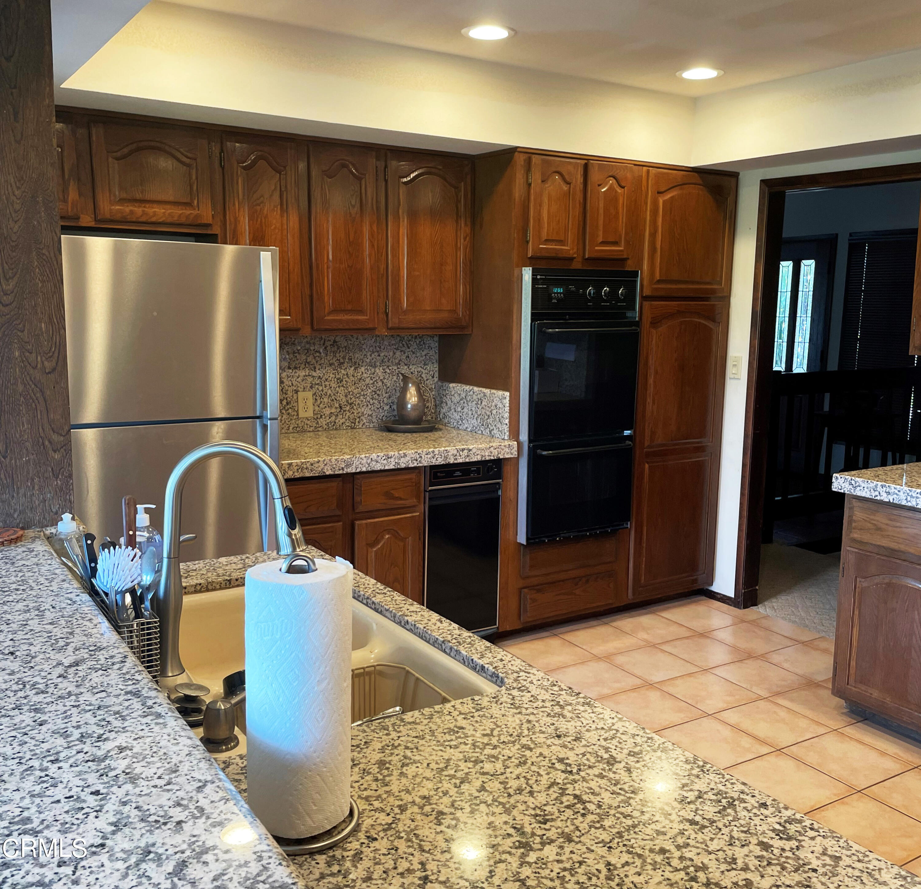 75 Marine View Drive Camarillo, CA 93010 - Photo 8 of 18 a kitchen with stainless steel appliances granite countertop a refrigerator and a stove top oven