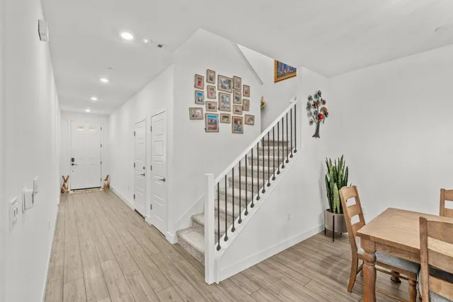 a bathroom with a tub sink and mirror