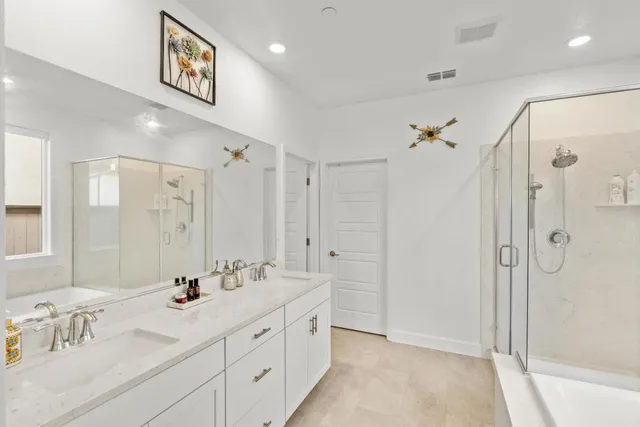 a kitchen with stainless steel appliances a stove a sink and cabinets