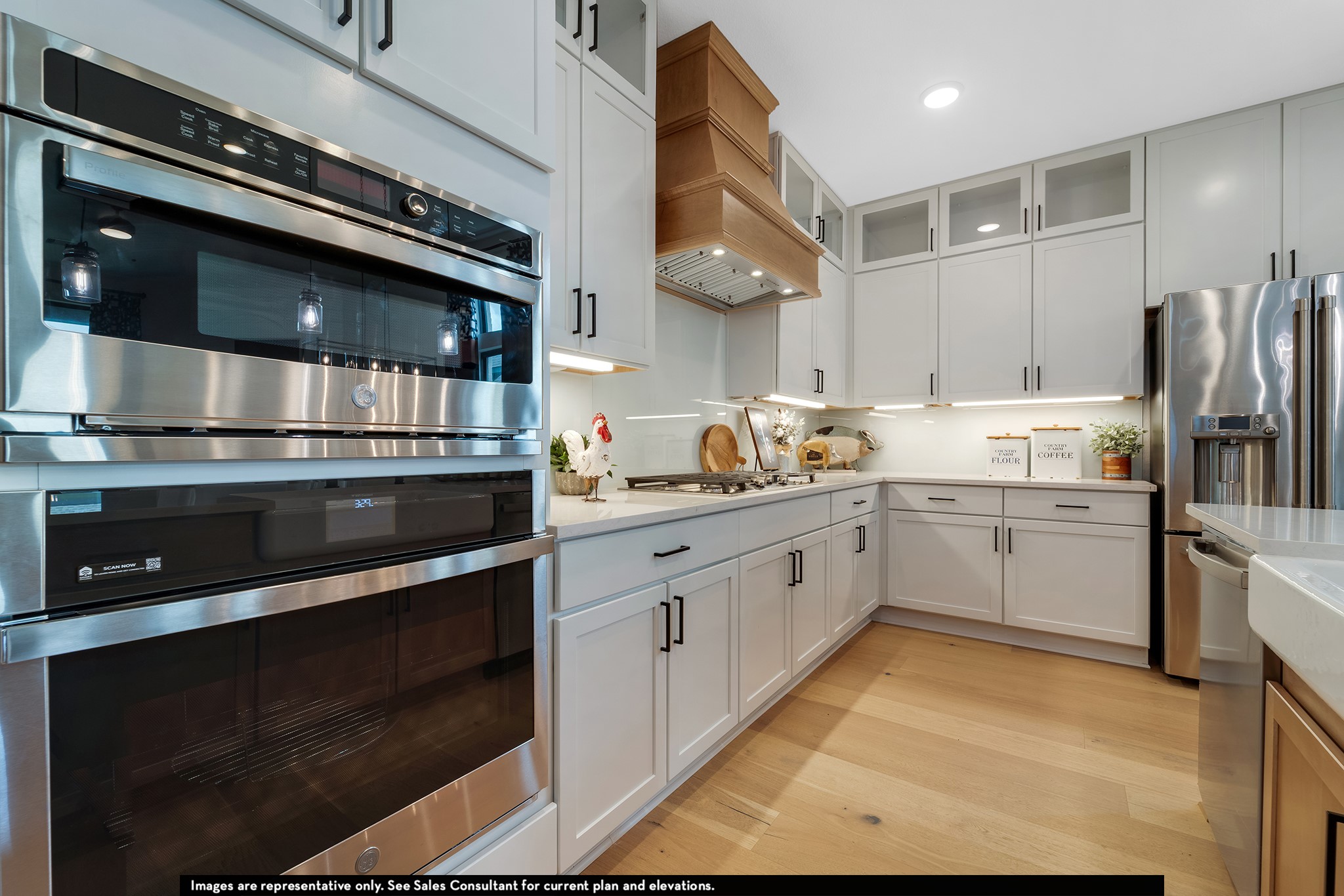 1923 Parks Edge Lane Angleton, TX 77515 - Photo 3 of 30 a kitchen with stainless steel appliances and white cabinets