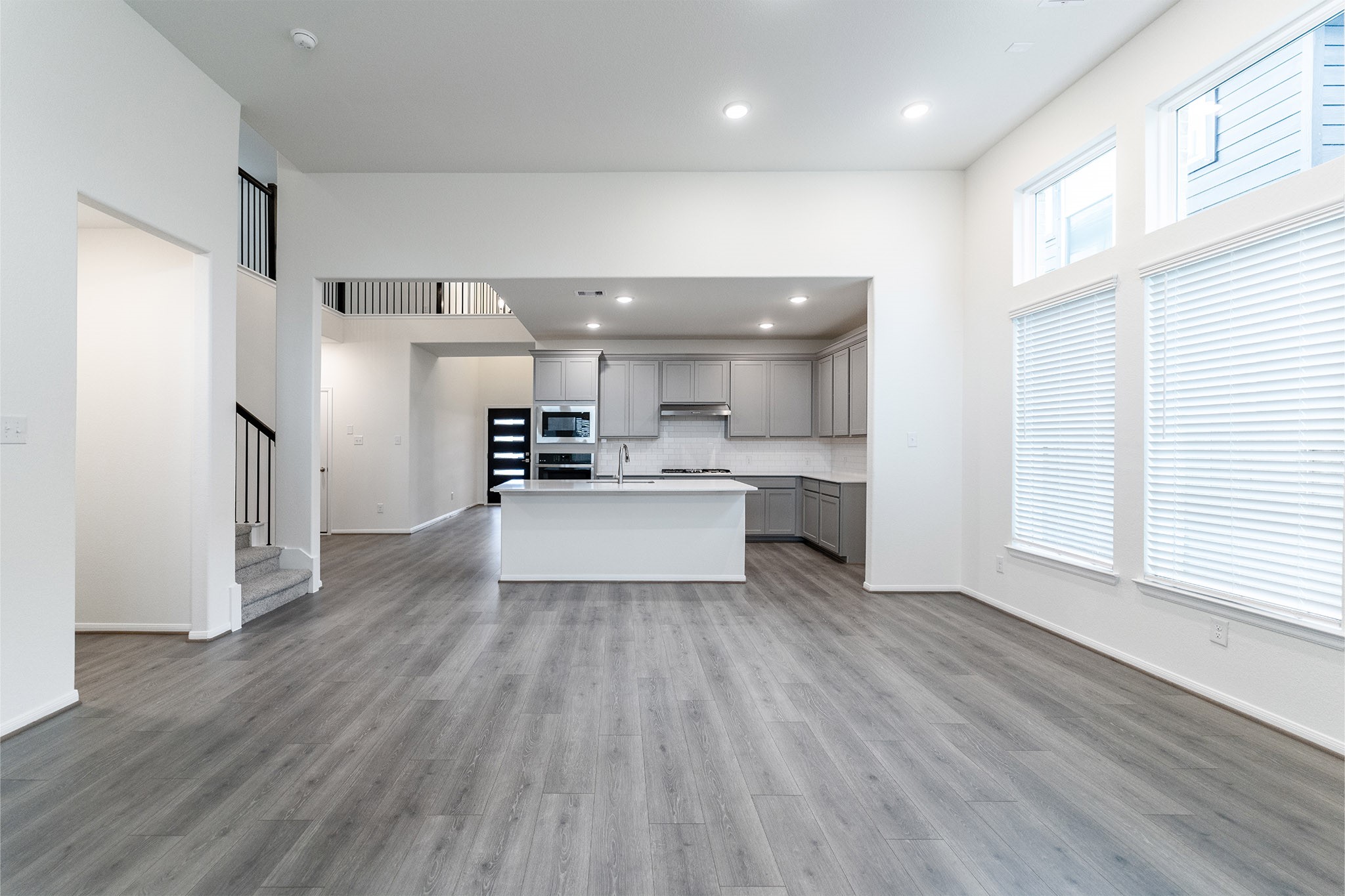 1923 Parks Edge Lane Angleton, TX 77515 - Photo 9 of 25 a view of a kitchen with wooden floor and electronic appliances