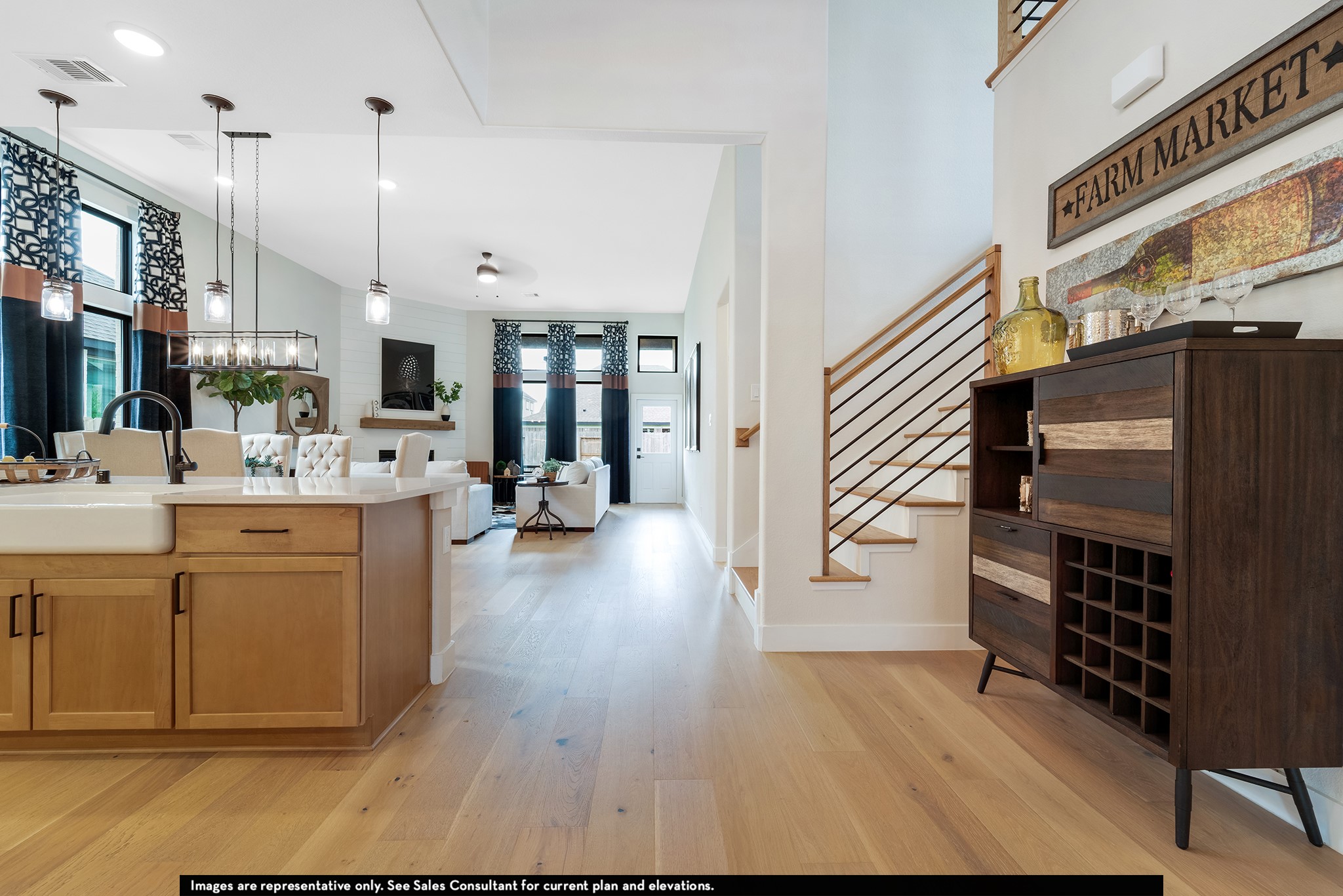 1923 Parks Edge Lane Angleton, TX 77515 - Photo 10 of 30 a open kitchen with stainless steel appliances kitchen island granite countertop a refrigerator a oven a sink and white cabinets with wooden floor