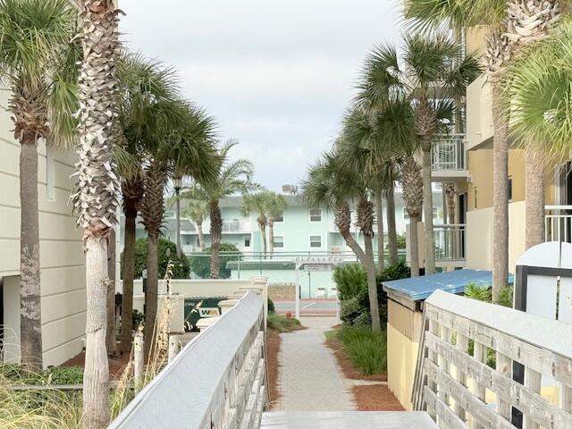 885 Santa Rosa Boulevard, Unit 111A Fort Walton Beach, FL 32548 - Photo 12 of 16 a city street lined with buildings and trees