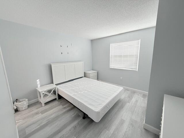 885 Santa Rosa Boulevard, Unit 111A Fort Walton Beach, FL 32548 - Photo 3 of 16 a room with a bed and window