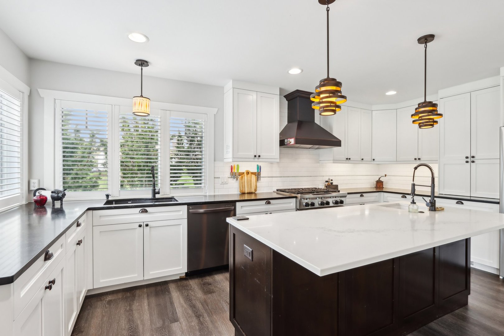 598 Rockefeller Road Lake Forest, IL 60045 - Photo 11 of 86 a kitchen that has a sink a stove and a wooden floors