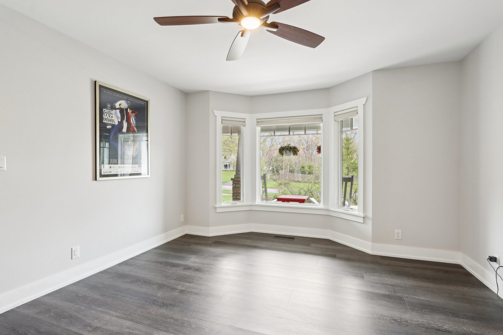 598 Rockefeller Road Lake Forest, IL 60045 - Photo 25 of 86 a view of empty room with wooden floor and fan