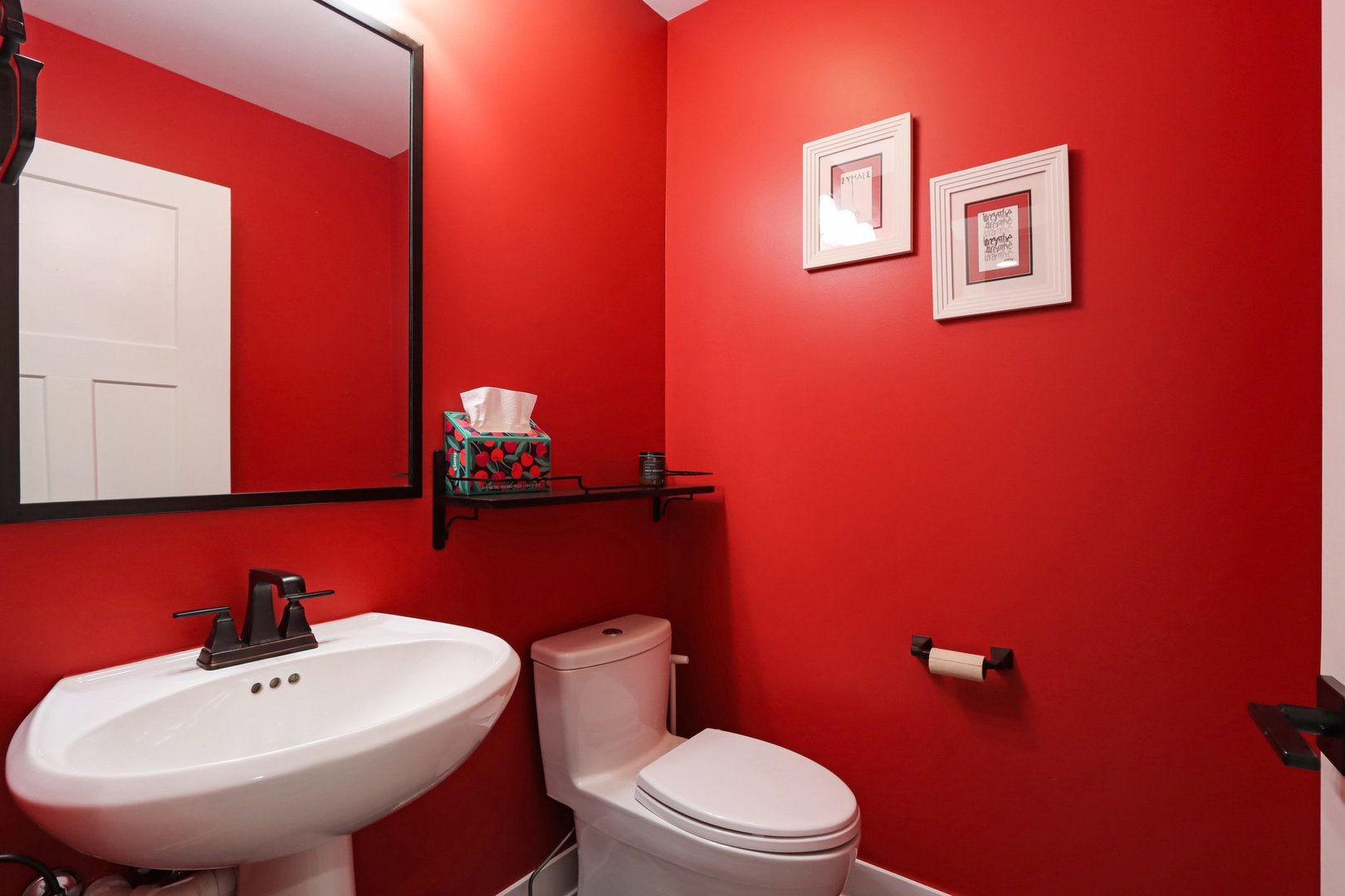 598 Rockefeller Road Lake Forest, IL 60045 - Photo 27 of 86 a bathroom with a toilet a sink and mirror