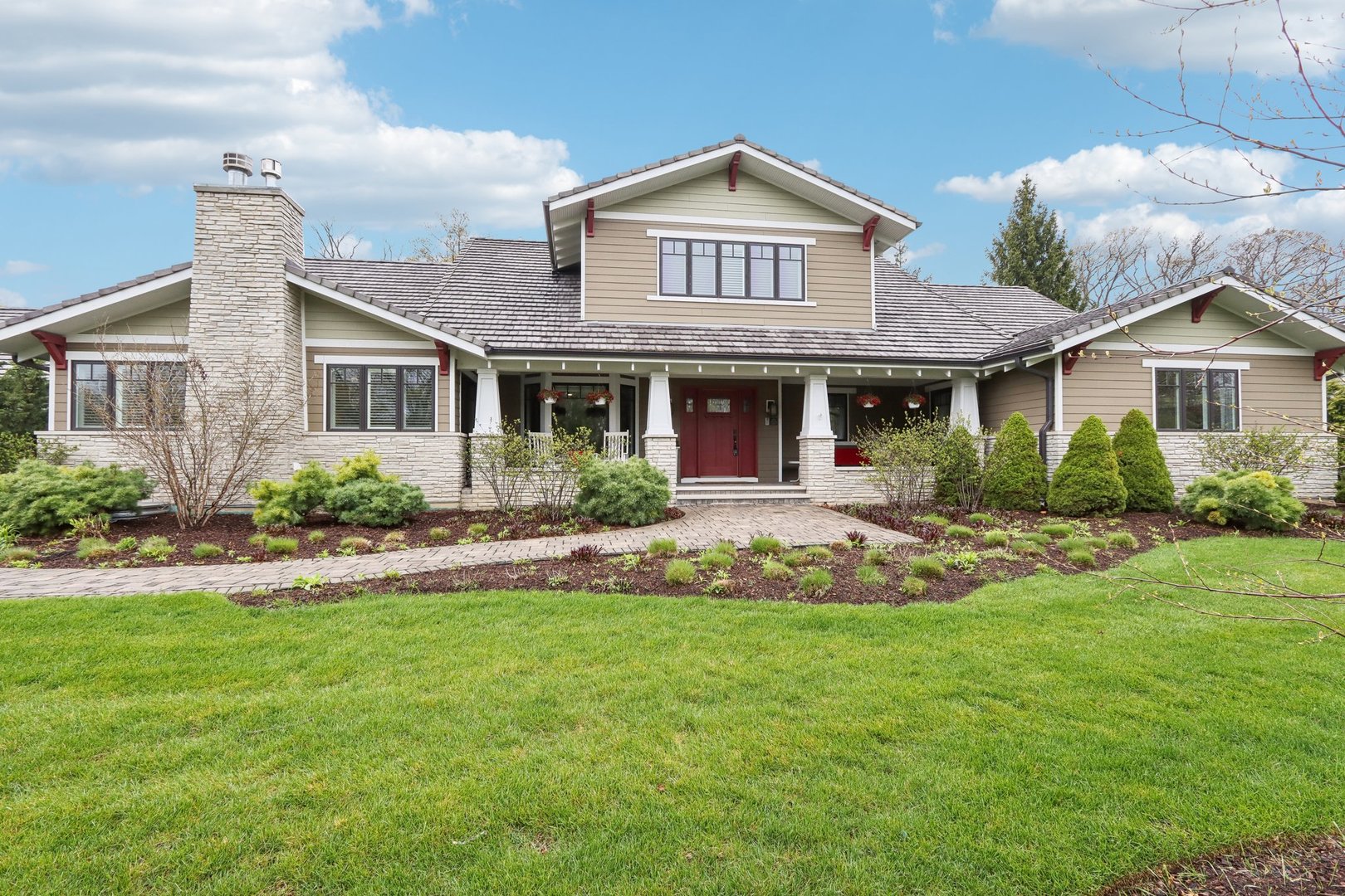 598 Rockefeller Road Lake Forest, IL 60045 - Photo 3 of 86 a front view of a house with a yard and potted plants
