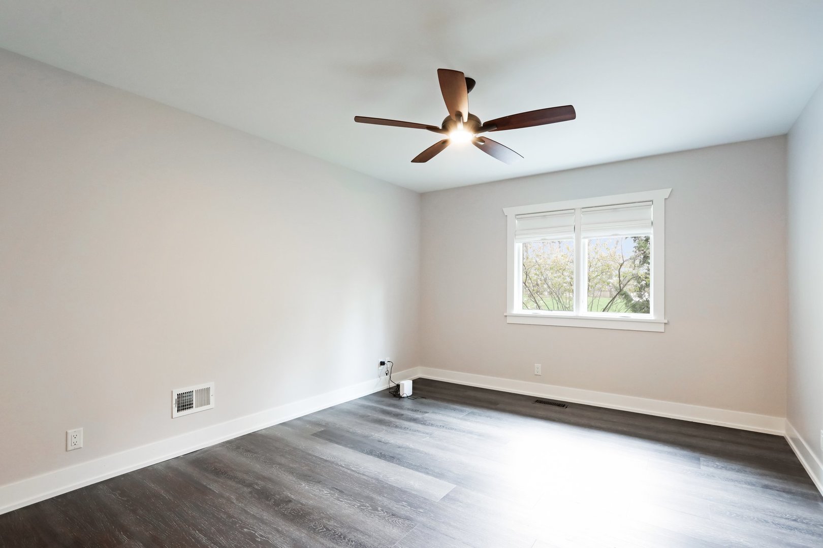 598 Rockefeller Road Lake Forest, IL 60045 - Photo 35 of 86 a view of empty room with wooden floor and fan