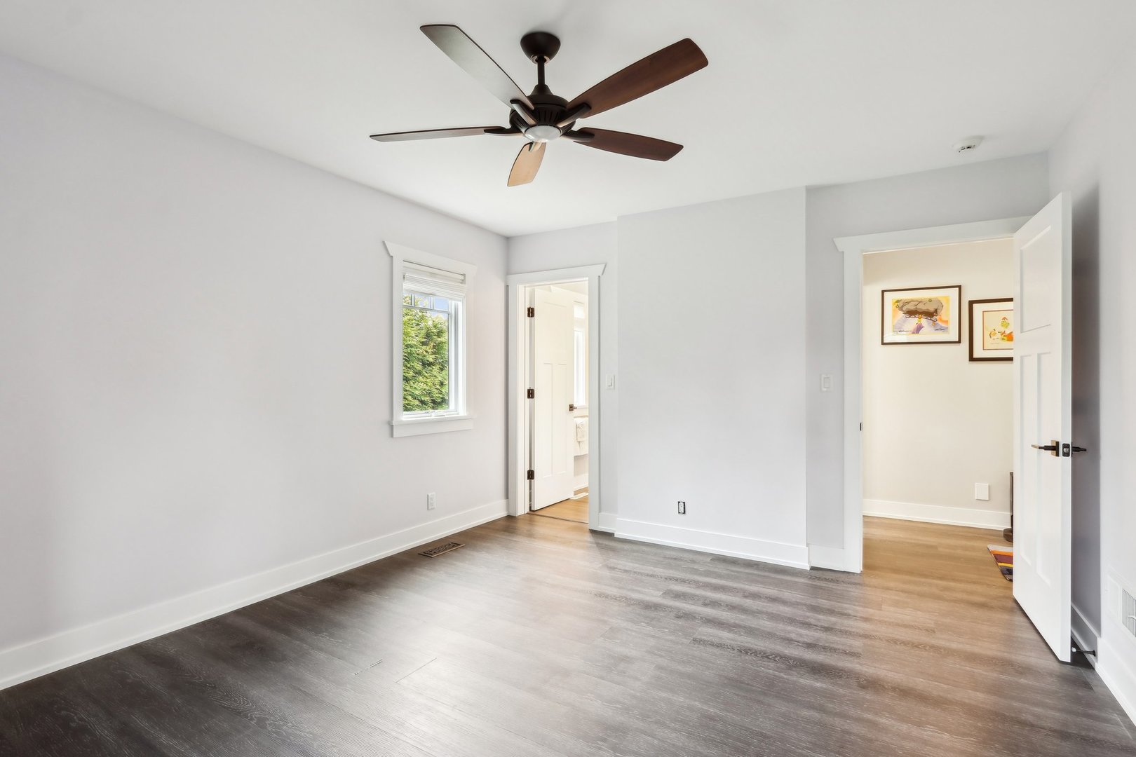 598 Rockefeller Road Lake Forest, IL 60045 - Photo 38 of 86 an empty room with wooden floor ceiling fan and windows
