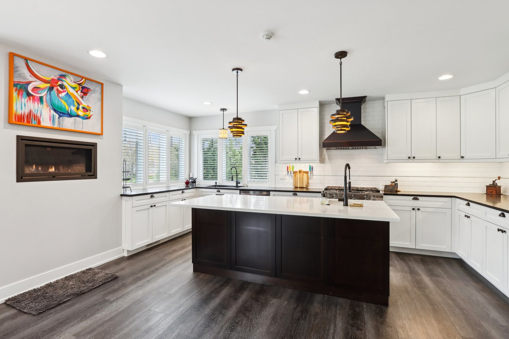 598 Rockefeller Road Lake Forest, IL 60045 - Photo 10 of 86 a kitchen with stainless steel appliances granite countertop a sink a stove and a wooden floors