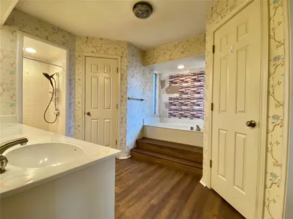 a bathroom with a sink and a mirror