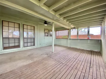 a view of a room with wooden floor