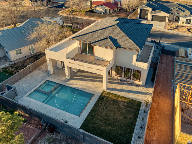 226 East 1100 North Hurricane, UT 84737 - Photo 7 of 49 Relaxing pool / spa with a patio area, a fenced backyard, and a residential view