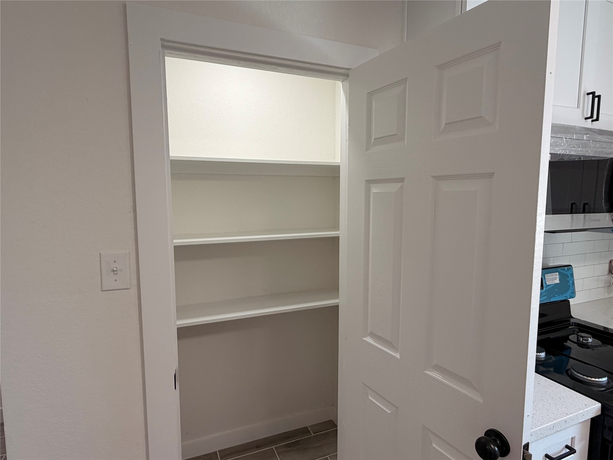 5842 Beldart Street Houston, TX 77033 - Photo 4 of 24 a room with a closet and a stove
