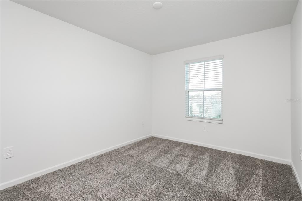 256 Hayley Street Lake Wales, FL 33859 - Photo 12 of 15 an empty room with a window