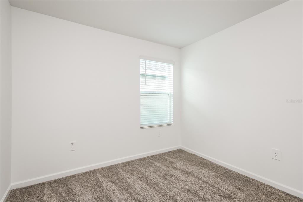 256 Hayley Street Lake Wales, FL 33859 - Photo 13 of 15 an empty room with a window