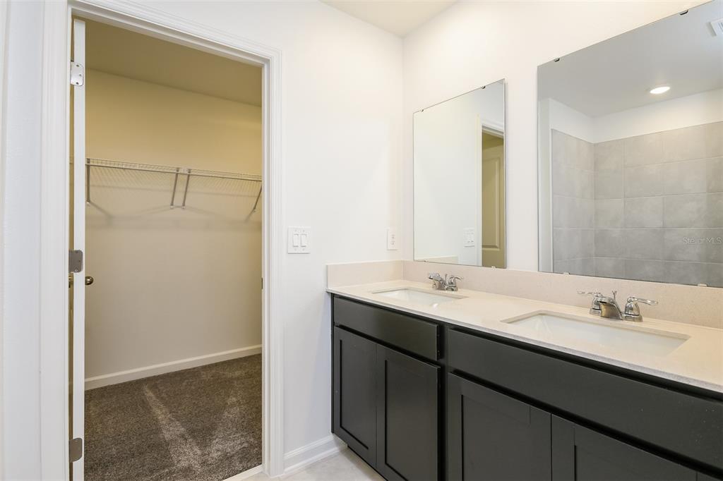 256 Hayley Street Lake Wales, FL 33859 - Photo 10 of 15 a bathroom with a sink and a mirror