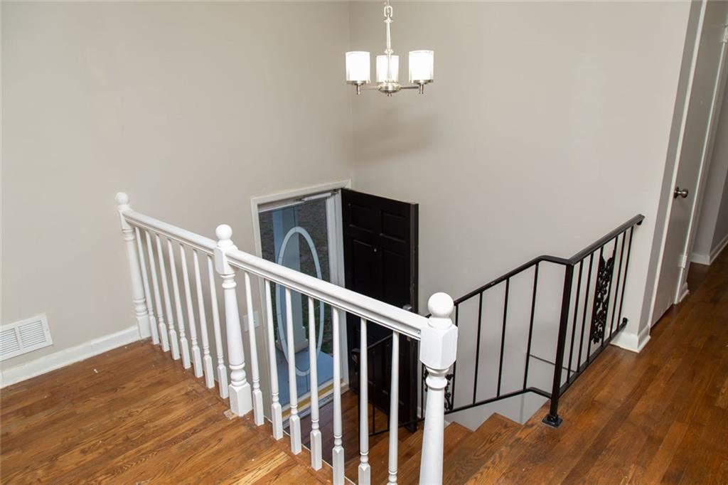 1681 Atherton Circle Decatur, GA 30035 - Photo 2 of 17 a view of a hallway with wooden floor and staircase