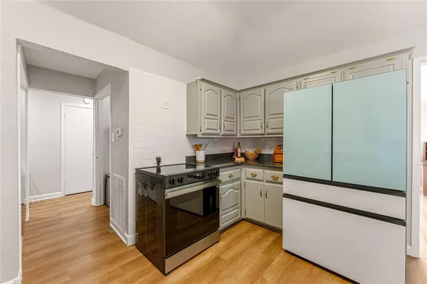 a kitchen with granite countertop a stove and a granite counter tops