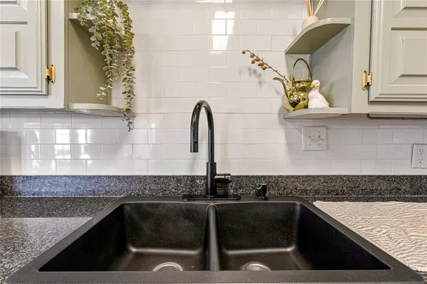 a kitchen with stainless steel appliances granite countertop a stove and a sink