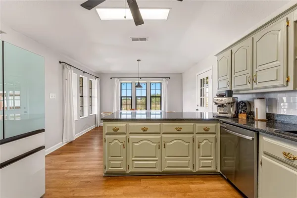 a spacious bedroom with a bed and a couch