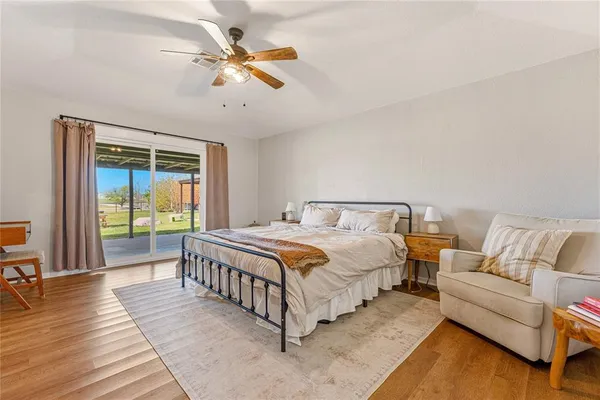 a bedroom with a bed and a chair