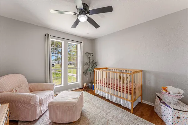 a bedroom with furniture and a window