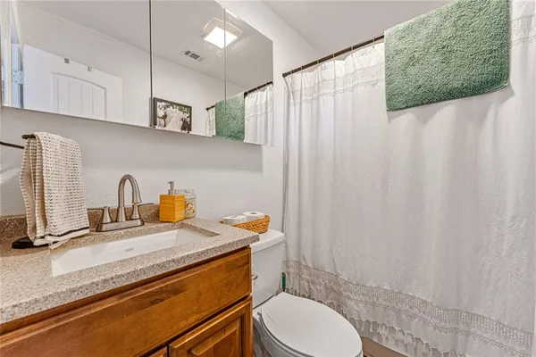 a dining room with furniture a chandelier and wooden floor