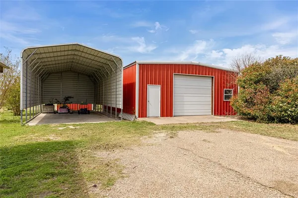 a view of a lake with couches and city view