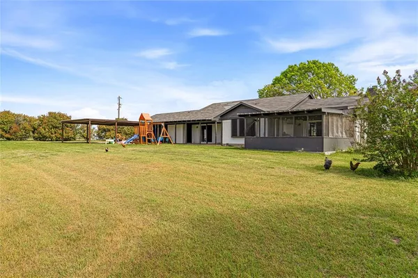 a view of a lake with houses in the back