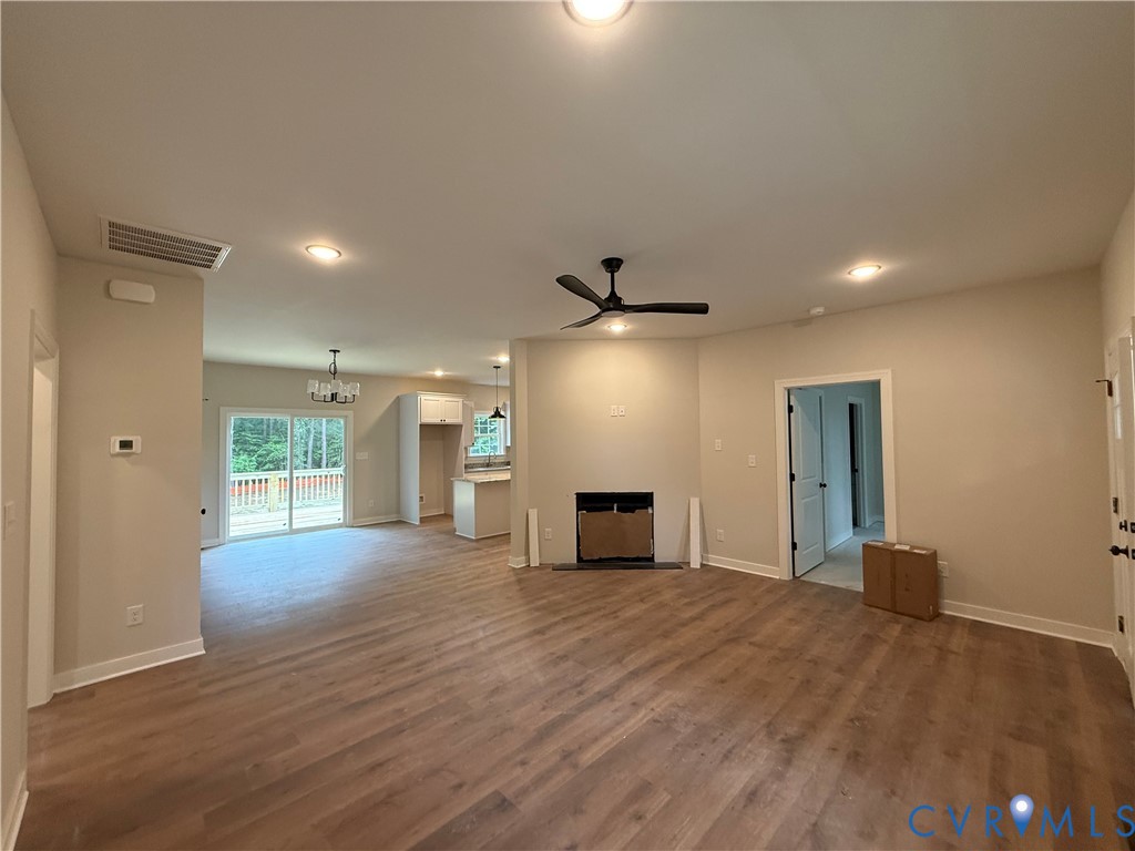 20545 Braxton Road Barhamsville, VA 23011 - Photo 6 of 22 a view of a livingroom with a fireplace and window