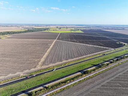 a view of a tennis court with an ocean view