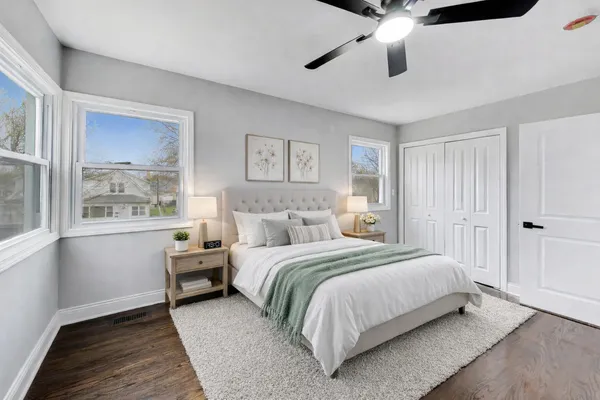 a bedroom with a bed and a window