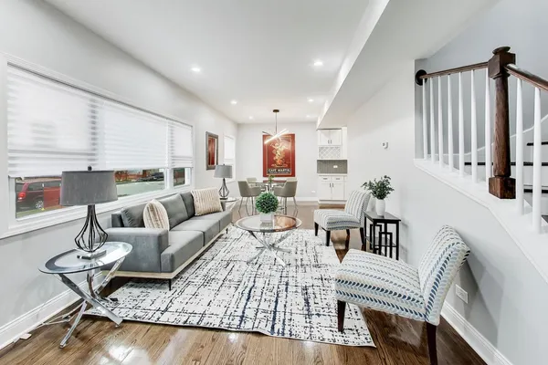 a living room with furniture or couch and a dining table