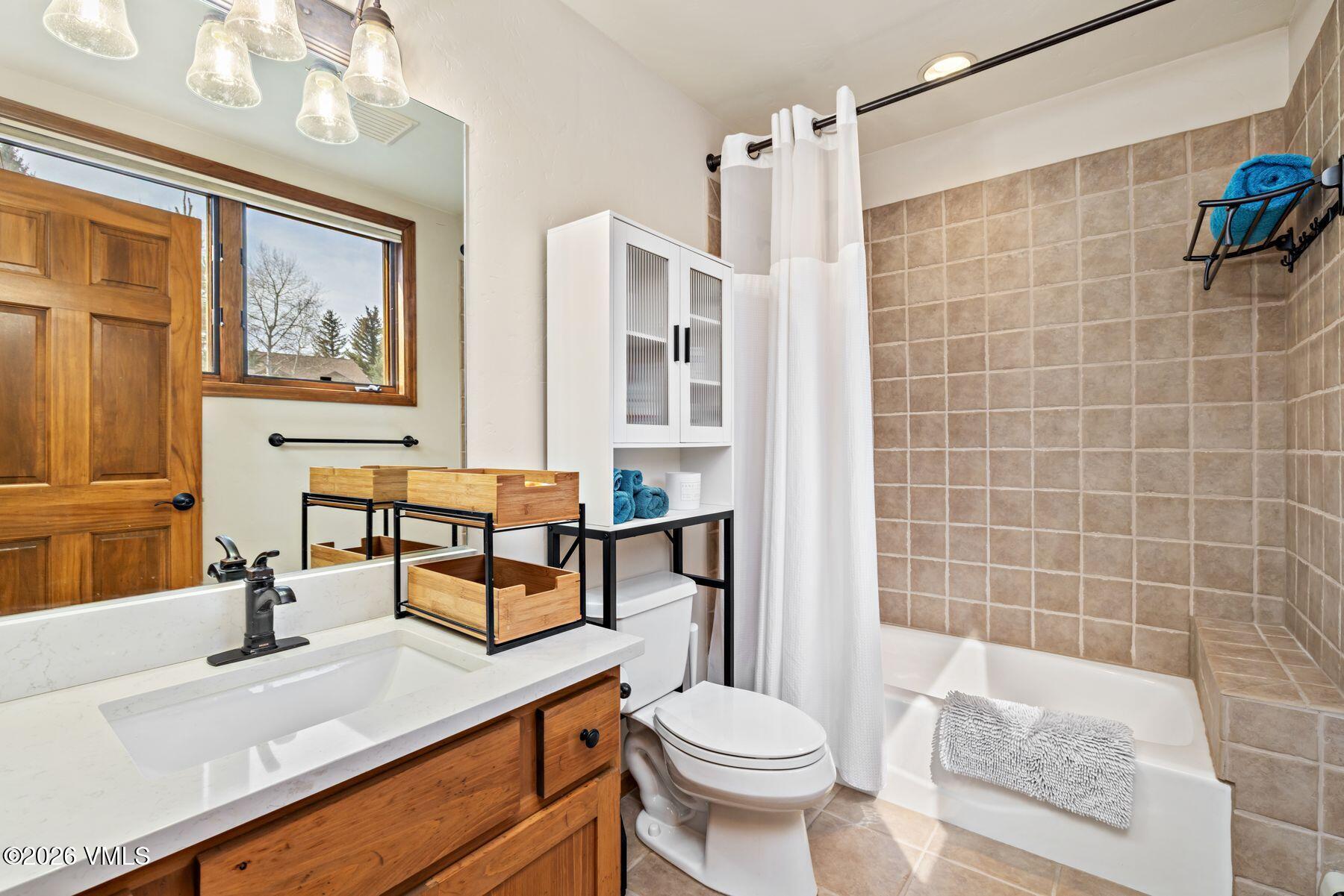 91 Creamery Trail Edwards, CO 81632 - Photo 29 of 44 a bathroom with a sink a toilet and shower