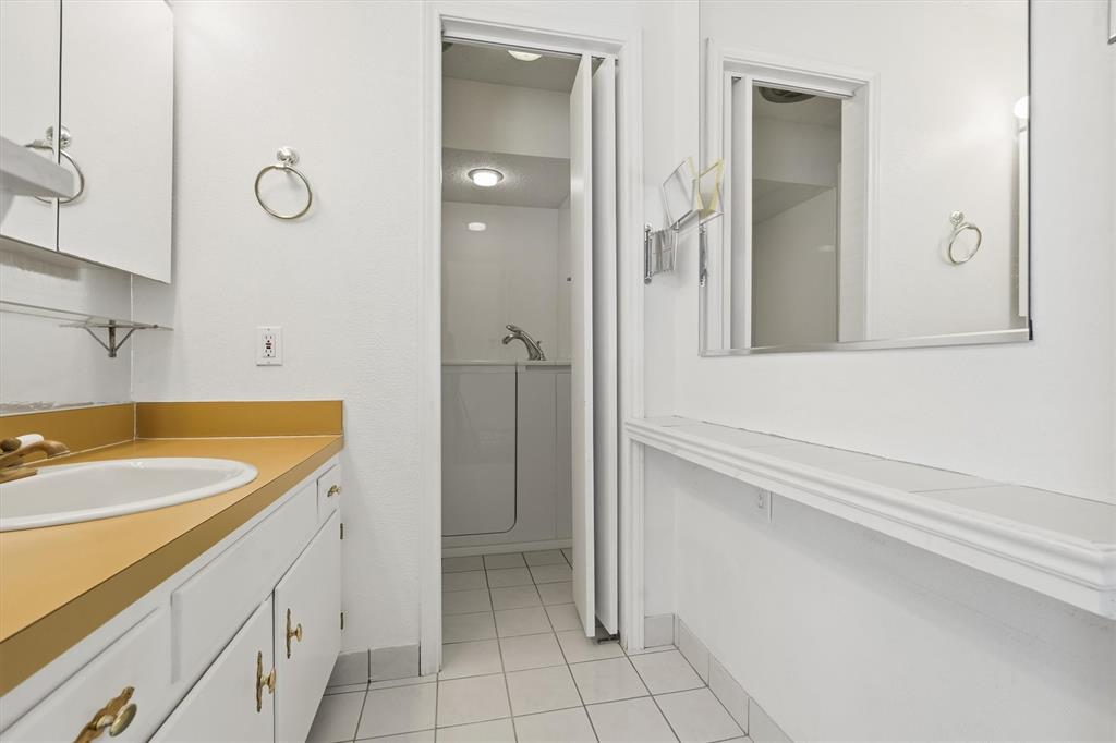 1817 Indian School Road Garland, TX 75044 - Photo 18 of 40 Bathroom with vanity and light tile patterned flooring