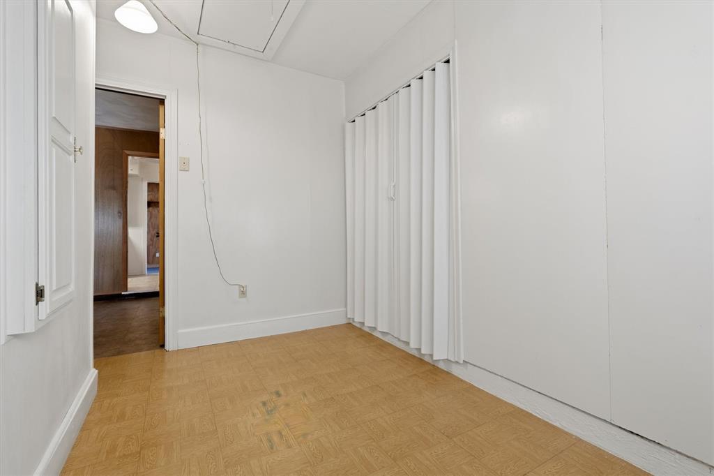 1817 Indian School Road Garland, TX 75044 - Photo 19 of 40 Unfurnished room with attic access and baseboards
