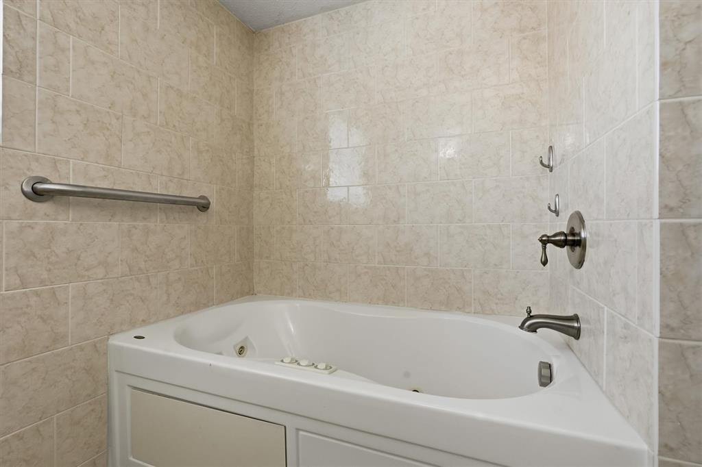 1817 Indian School Road Garland, TX 75044 - Photo 23 of 40 Full bath with tile walls
