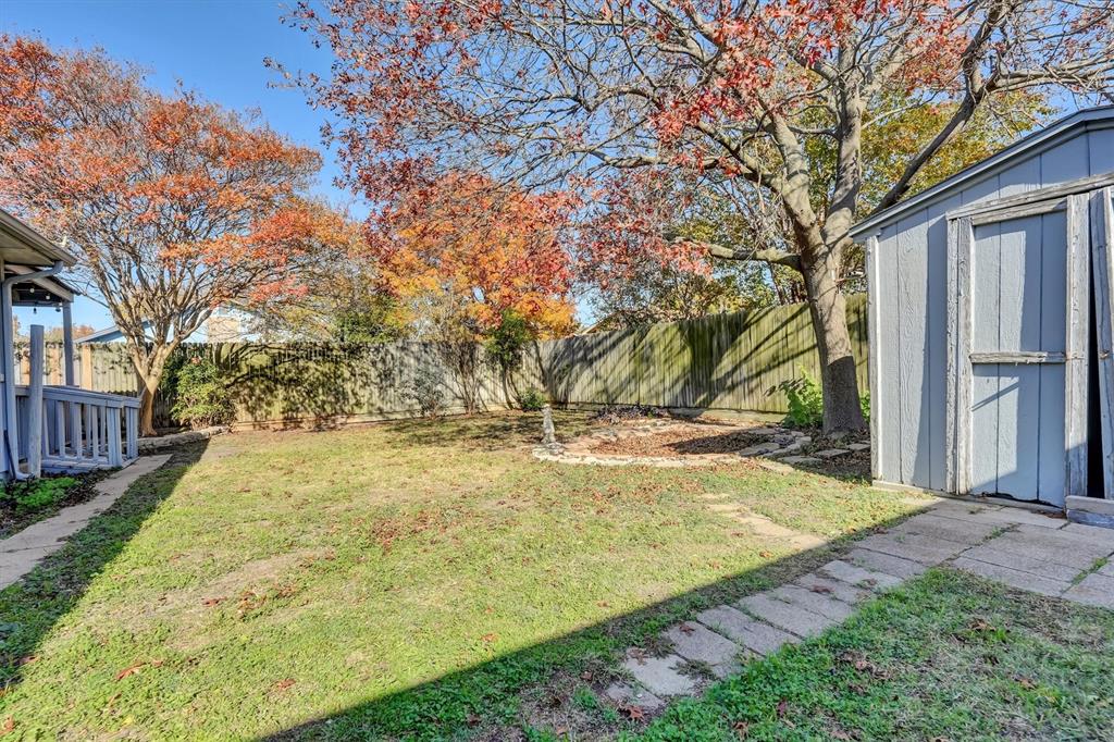 1817 Indian School Road Garland, TX 75044 - Photo 36 of 40 Fenced backyard featuring a shed