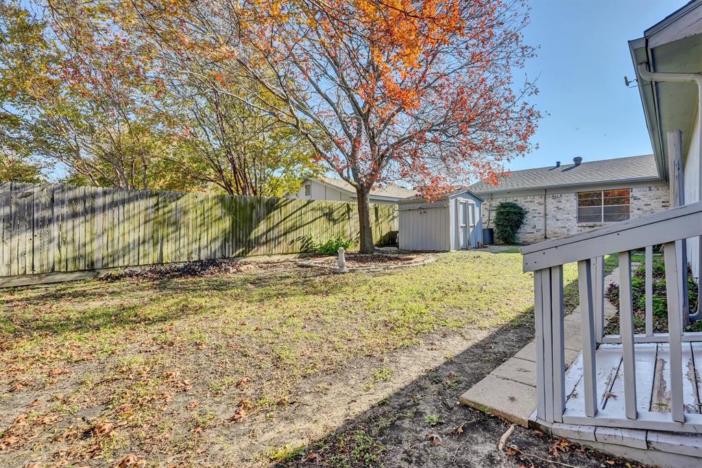 1817 Indian School Road Garland, TX 75044 - Photo 40 of 40 Fenced backyard with a storage unit